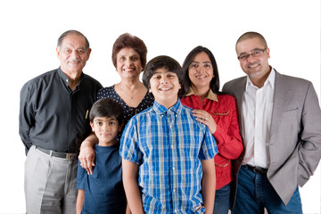 An extended Indian family all pose together in a fun setting