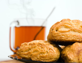 Baked tasty cakes and cup of tea