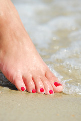 Body care.  Woman foot  in the  water. Health Spa.