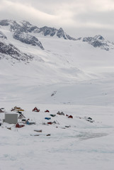 A small inuit village lost in a snowy landscape