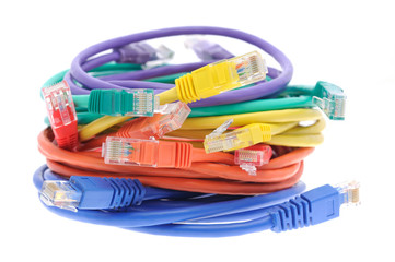 Stack of colorful network cables in isolated white background