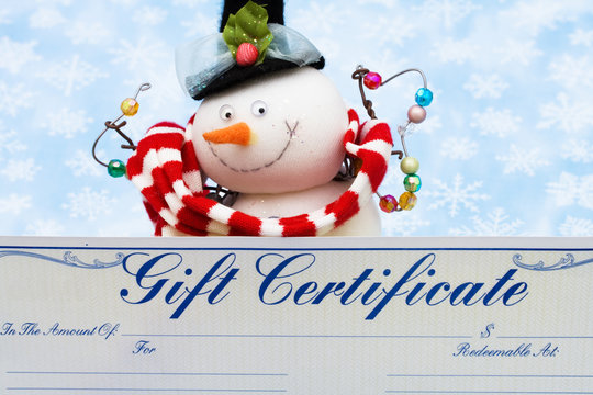 Snowman with gift certificate on blue snowflake background