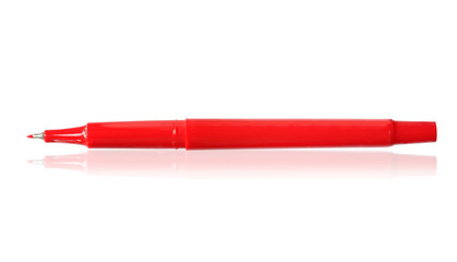 Red felt-tip pen, reflected on white surface.