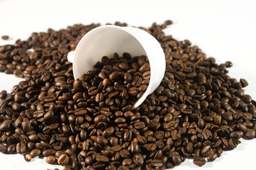 White cup with coffee beans (on white background)