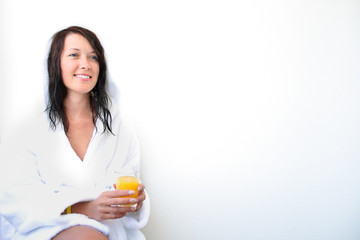 Young smiling woman with orange juice