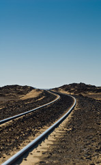 Fototapeta na wymiar Train tracks into the Black Desert