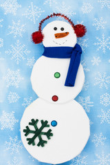 Snowman on snowflake background, merry Christmas