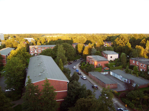 Kind on a city from height, houses, trees