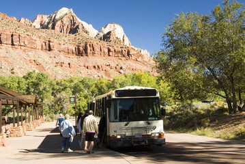 A porpane fueled shuttle bus stops at the  Zion Visitor's Center