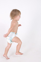 little naked girl in diaper is running