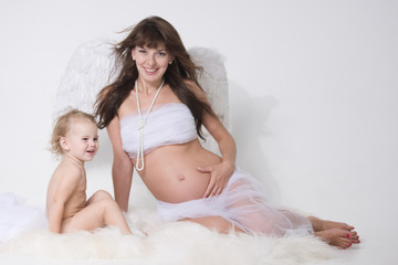 angel mather with wings and her seating daughter