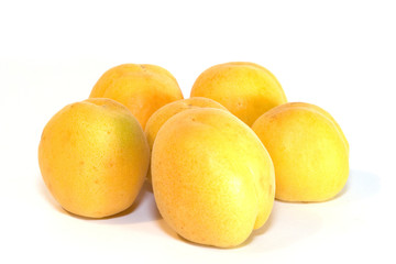 Ripe yellow Apricots on white background