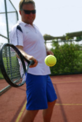 man plays in tennis