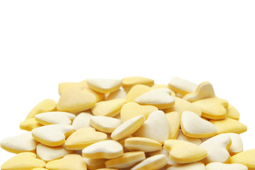 Pile of vitamin tablets isolated over white background