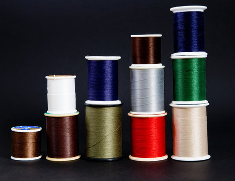 Five stacks of multi-color thread