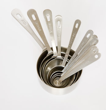 A group of measuring cups and spoons nested