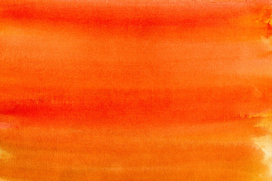 Orange colors painted canvas watercolor wash background.