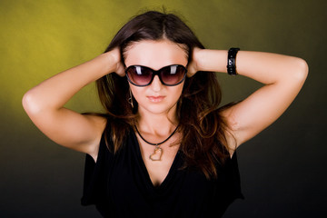 Portrait of the girl in a dress and in sunglasses