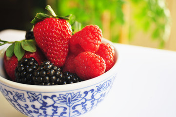 Blackberry, Raspberry and Strawberries in a small bowl.