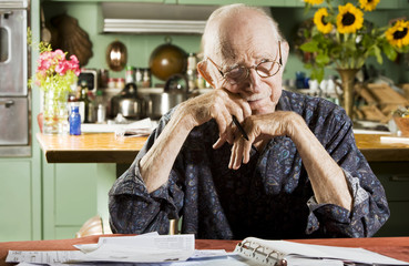 Elder Man at Home with Bills