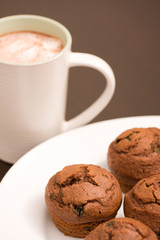 Frehsly baked muffins and hot chocolate