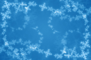Fototapeta na wymiar white snow flakes on a blue background