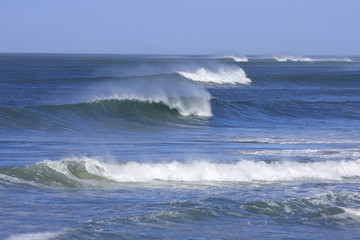 rows of beautiful waves with  sea spray