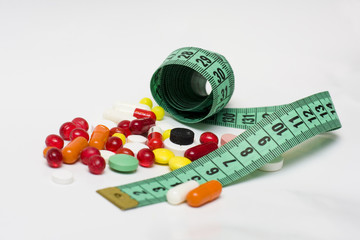 Measure tape with diet pills