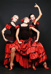 spanish dancers over dark background