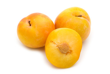 slice fresh yellow plum on white background