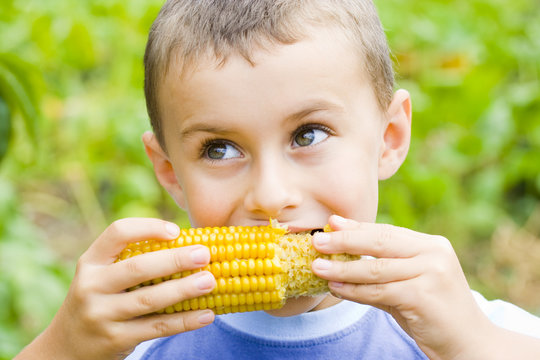 Boy Eating Fresh Boiled Corn