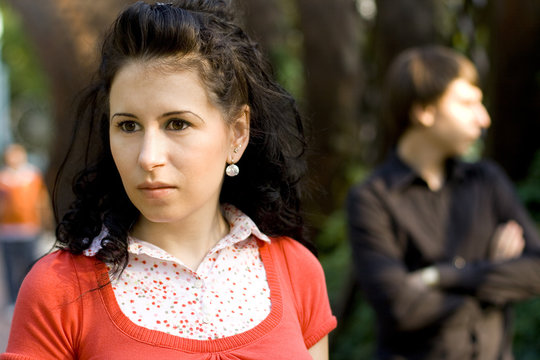 Outdoor Portrait Of Unhappy Young Couple