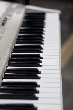 A selective focus image down an electronic keyboard.