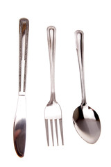 Knife, fork and spoon isolated on white