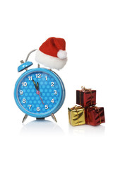 Alarm clock with christmas hat, reflected on white background