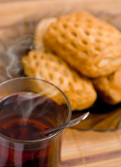 Baked tasty cakes and cup of tea