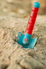 toy trowel in sand