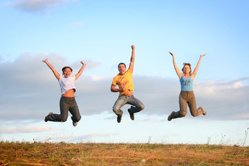 happy jumping people outdoors