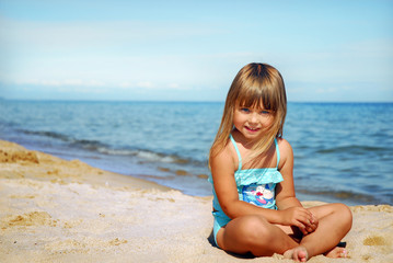 Little cute girl on the beach