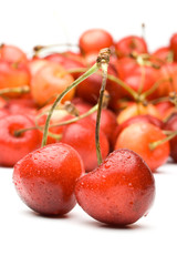 Fresh appetizing sweet cherry on a white background