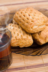 Baked tasty cakes and cup of tea