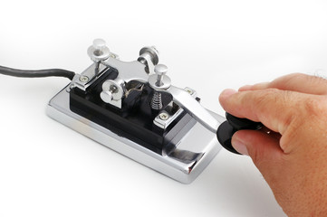 vintage morse telegraph key with white background
