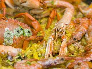 Close shot of a typical spanish paella being cooked outdoors