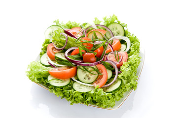 Fresh salad with onion, tomato and basil