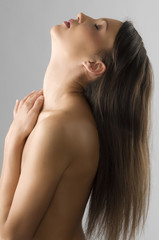 Fototapeta premium freedom shot of beautiful girl with her head up and long hair