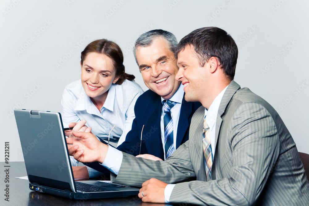 Canvas Prints Portrait of smiling people discussing a computer work