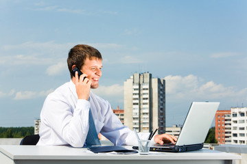 Image of successful entrepreneur speaking by telephone