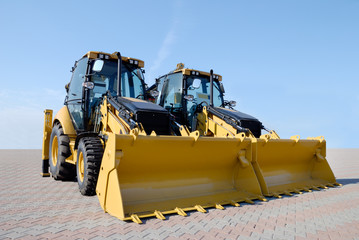 Two new bulldozers on a show-window