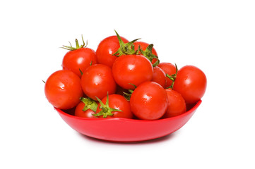 Wet whole tomatos arranged isolated on white