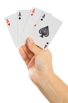 Four aces in a hand - isolated on white